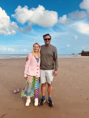 Laura and her husband smiling together outdoors during her recovery after brain tumour surgery.